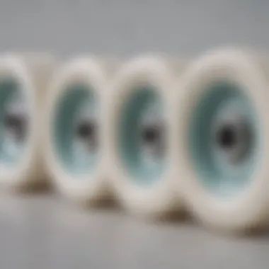 Different sizes of white longboard wheels displayed side by side