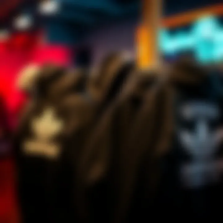 A collection of black hoodies from various skate brands on display.