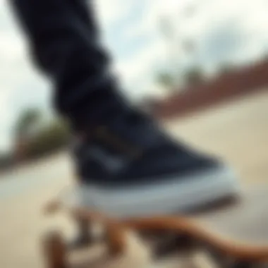 Skateboarder wearing black Vans with gold eyelets