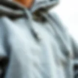 A close-up of a soft grey hoodie showcasing its fabric texture and detailing