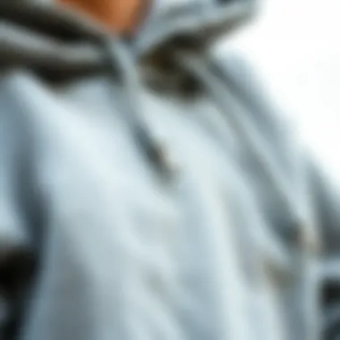 A close-up of a soft grey hoodie showcasing its fabric texture and detailing
