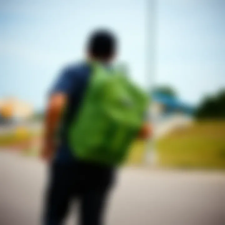 Skateboarder utilizing the Dakine Green Backpack while riding