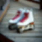 A pair of sleek adult roller blades resting on a wooden surface