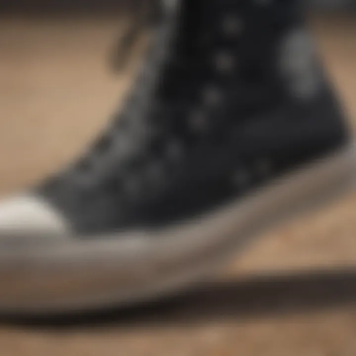 Close-up of the textured canvas of Chuck Taylor All Star Lift Hi in black, showcasing its unique design.