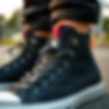 Close-up of black hi-top Converse with unique design elements
