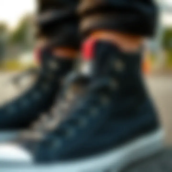 Close-up of black hi-top Converse with unique design elements
