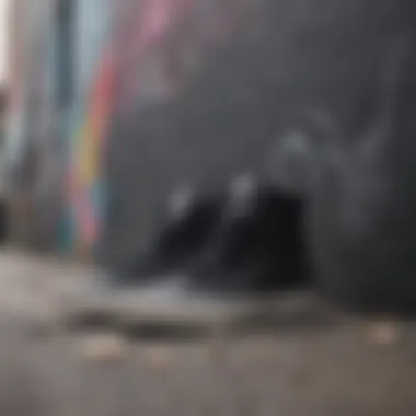 Stylish arrangement of black hi-top Vans against a graffiti backdrop