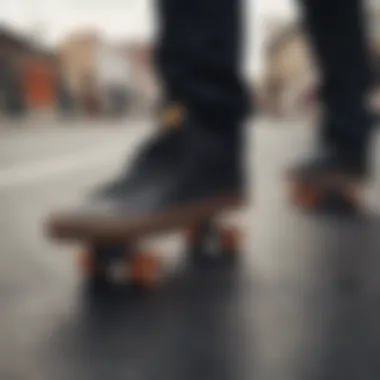 A pair of black leather Vans on a skateboard deck