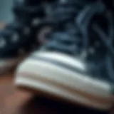 Close-up view of black on black Converse shoes showcasing their unique design and texture.