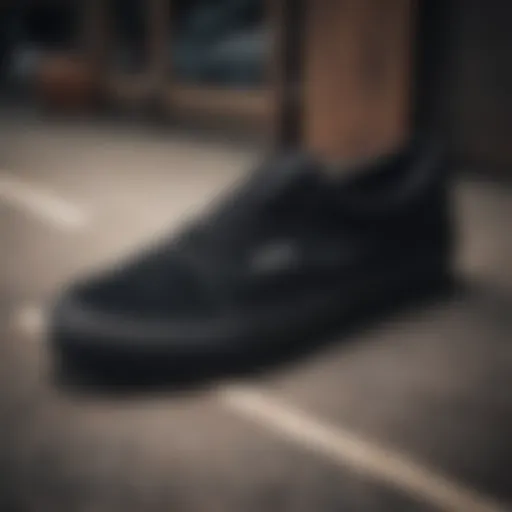 Detailed view of black Vans showcasing stitching and material quality