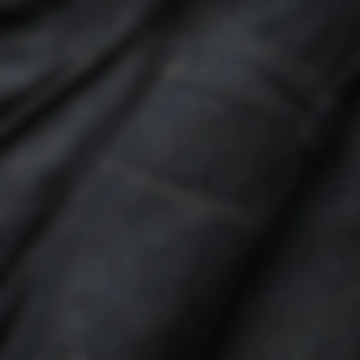 Close-up of black washed denim texture highlighting craftsmanship