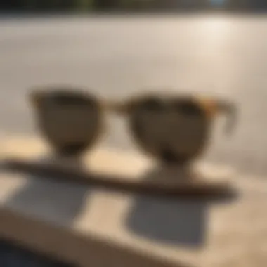 Ray-Ban gold black sunglasses displayed on a skateboard