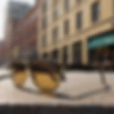 Stylish shot of Ray-Ban gold black sunglasses against an urban backdrop