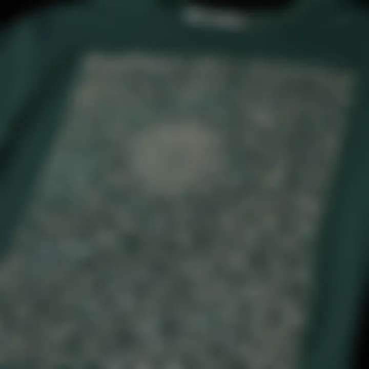 Close-up of the forest green graphic tee showcasing intricate designs