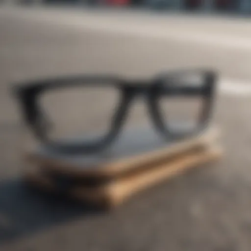 Close-up view of large black square glasses on a skateboard deck