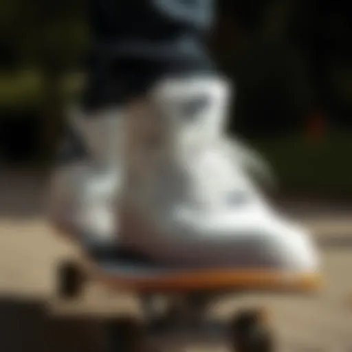 Close-up of white Nike Air high tops on a skateboard