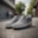 A pair of grey checkered slip-on Vans on a skateboard