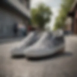 A pair of grey checkered slip-on Vans on a skateboard