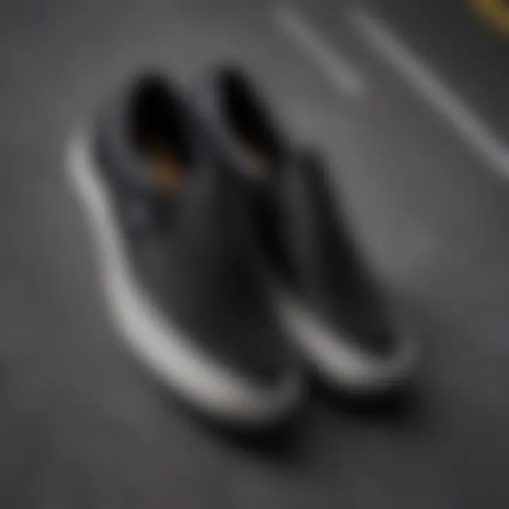 Close-up of black on black slip-on Vans on a skateboard