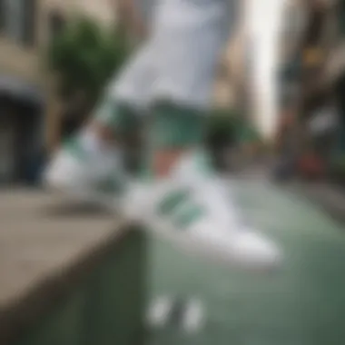 Skater showcasing white Adidas shoes with green accents in urban setting