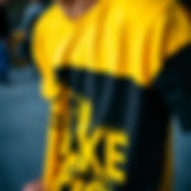 Close-up of a skateboarder wearing a black and yellow tee