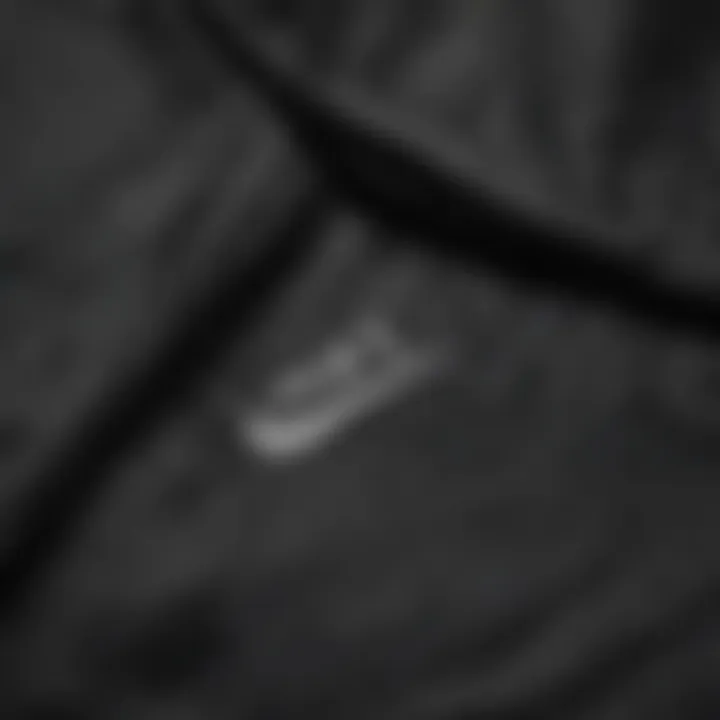 Close-up details highlighting the fabric and stitching of the Nike jacket