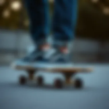 Artistic composition of Vans sneakers and denim blue pants on a skateboard
