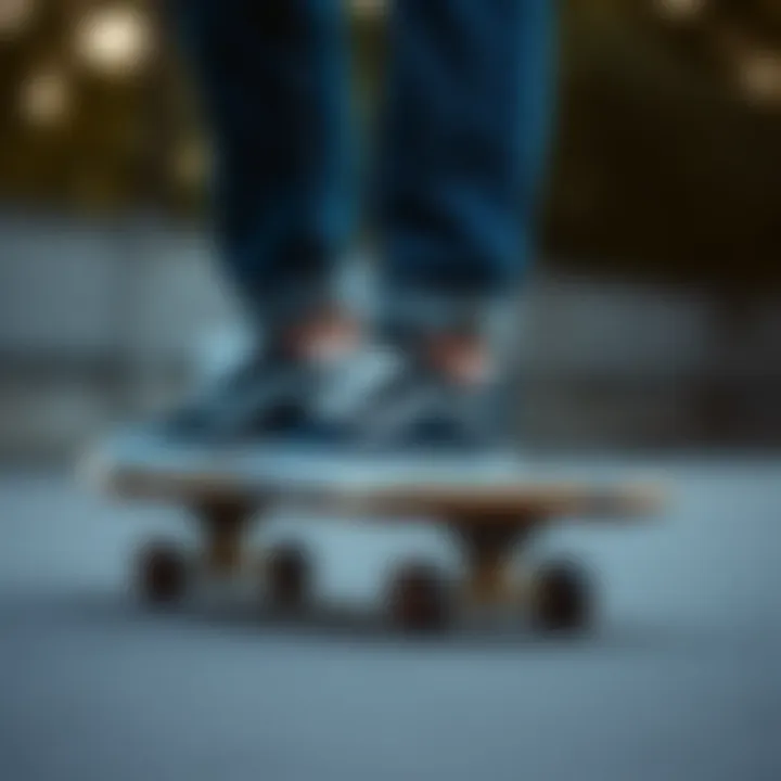 Artistic composition of Vans sneakers and denim blue pants on a skateboard