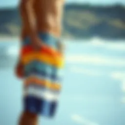 Stylish extra long board shorts on a beach backdrop