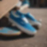 Classic blue Vans sneakers displayed on a skateboard