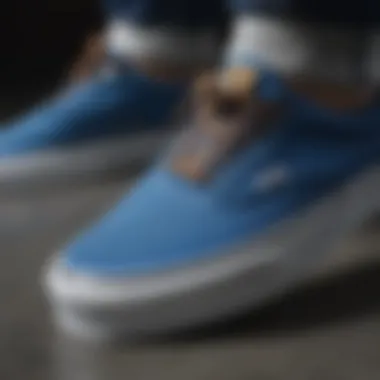 Close-up of blue Vans shoes highlighting their design and texture