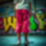 Vibrant neon pink board shorts against a graffiti backdrop