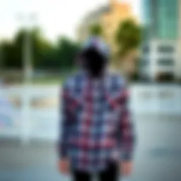 Plaid shirt hoodie displayed in an urban skate park setting