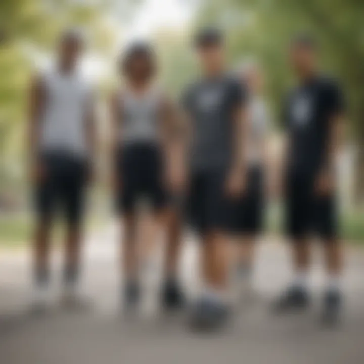 Group of skaters gathered in a park wearing black washed shorts