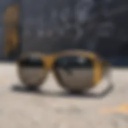 Stylish black and gold sunglasses against a graffiti backdrop