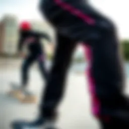 Stylish pink black sweats showcased in an urban skate park