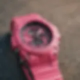 Stylish pink G Shock watch on a skateboard deck