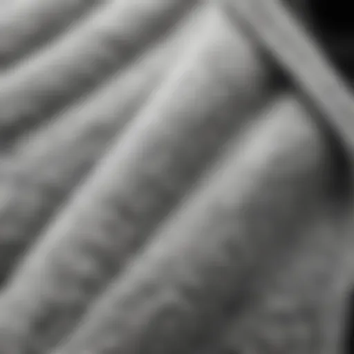 A close-up of the texture of a black and white fleece jacket, showcasing its soft fabric.