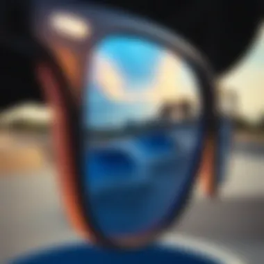 Close-up of blue glass sunglasses reflecting a skate park