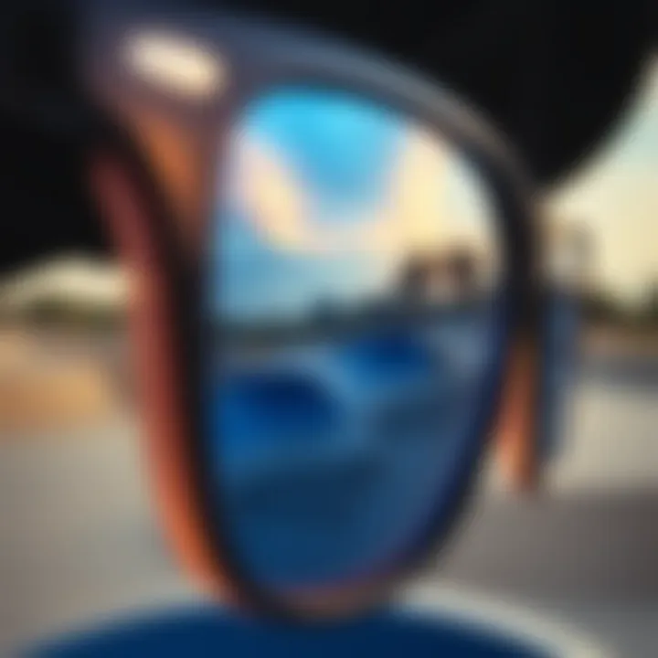 Close-up of blue glass sunglasses reflecting a skate park