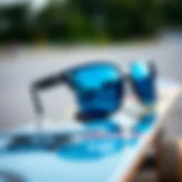 Stylish blue glass sunglasses on a skateboard deck