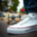 A close-up of Tilly's white Converse shoes with a skateboard in the background