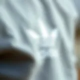 Close-up of the fabric texture of a grey Adidas sweatshirt