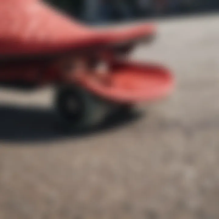 Close-up view of red Adilette slides on a skateboard