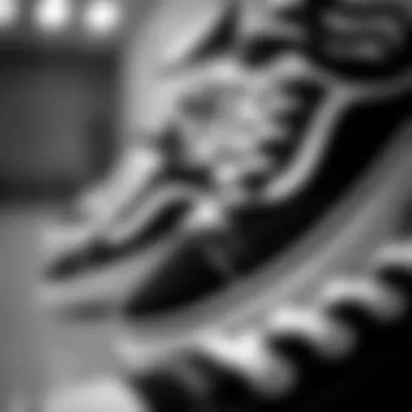 A close-up of black and white skate shoes, emphasizing the attention to detail and design in skate fashion.