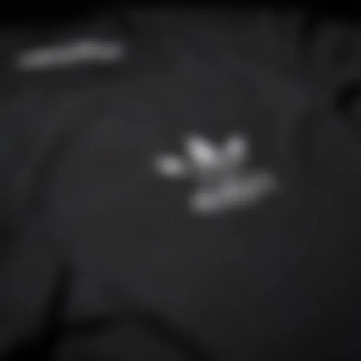 Close-up of the design details on a black Adidas t-shirt