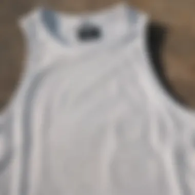 Close-up of Tilly's white tank top highlighting its fabric and design details suitable for skaters.