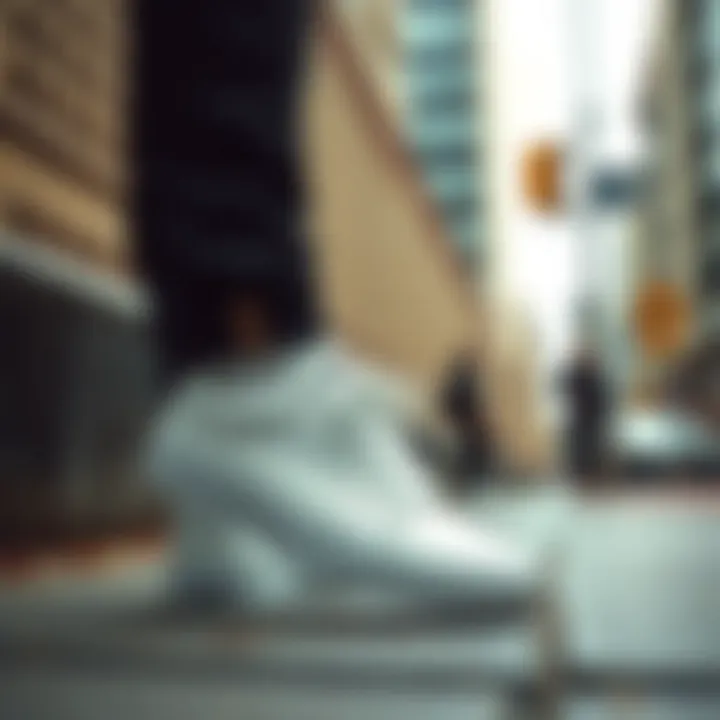 White Leather Vans in an Urban Setting Stylish white leather Vans low tops on urban pavement